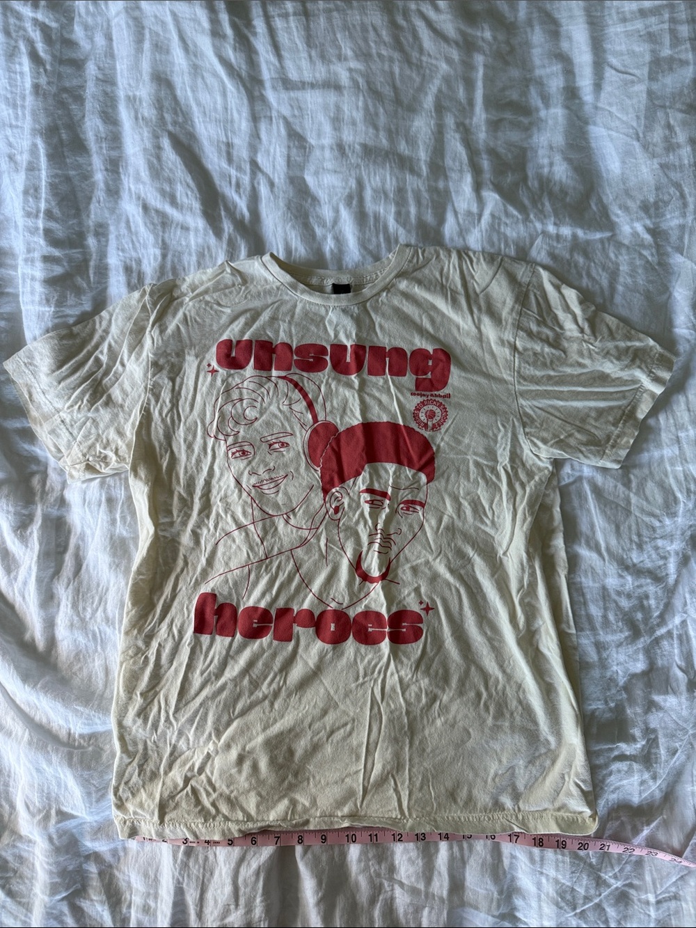 RTRS Unsung Heroes cream shirt featuring Producer CJ & Paul Reed (“BBall Paul”)